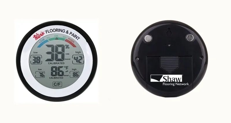 Pete's Flooring & Paint branded thermo-hygrometer, front, with Shaw Flooring Network branding on the back