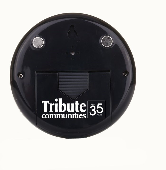 Tribute Communities branded thermo-hygrometer, rear view with logo